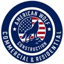 American Wolf Construction logo — navy circular badge with howling wolf and American flag