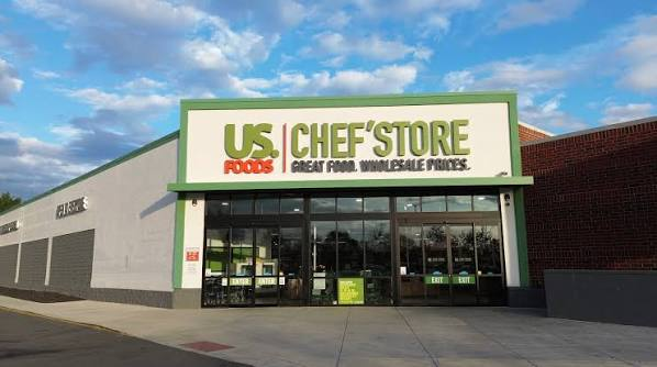 US Foods Chef'Store retail storefront with green and white signage under a blue sky